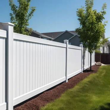 A new white vinyl fence providing a classic, low-maintenance boundary for an Auckland home.