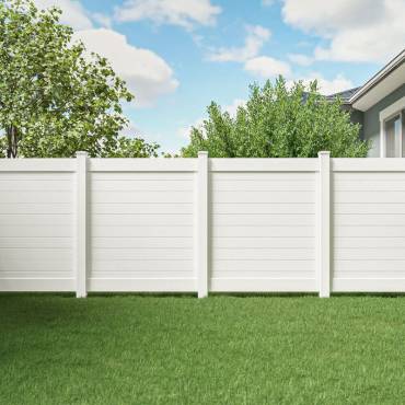 A stylish white vinyl privacy fence, a durable and clean-looking solution